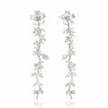 Silver floral earrings on a white background