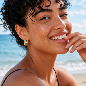 Woman with freckles smiling on a beach