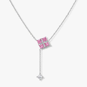 Silver necklace with pink square gemstones and a dangling clear gem pendant on a white background