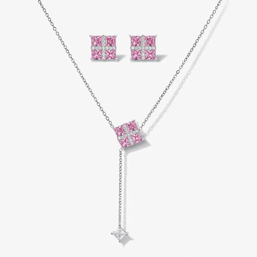 Square pink gemstone necklace and stud earring jewelry set on white background