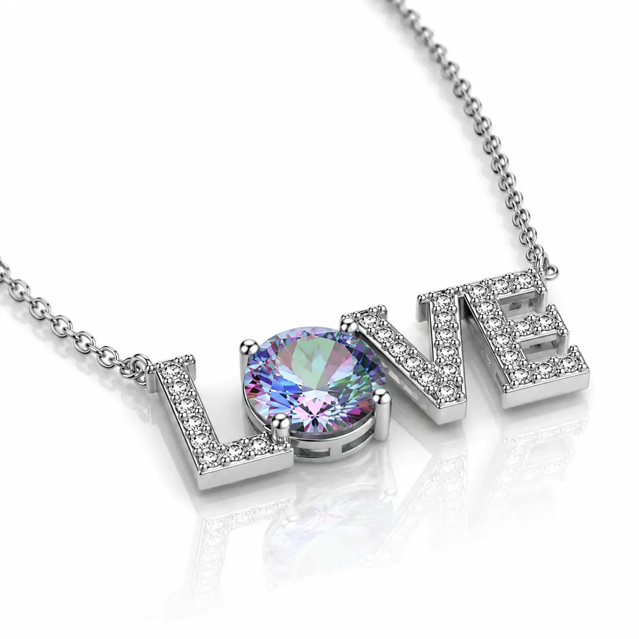 A silver-tone necklace spelling 'LOVE' with a large round iridescent gemstone at the center, set against a clean white background with a soft reflection.