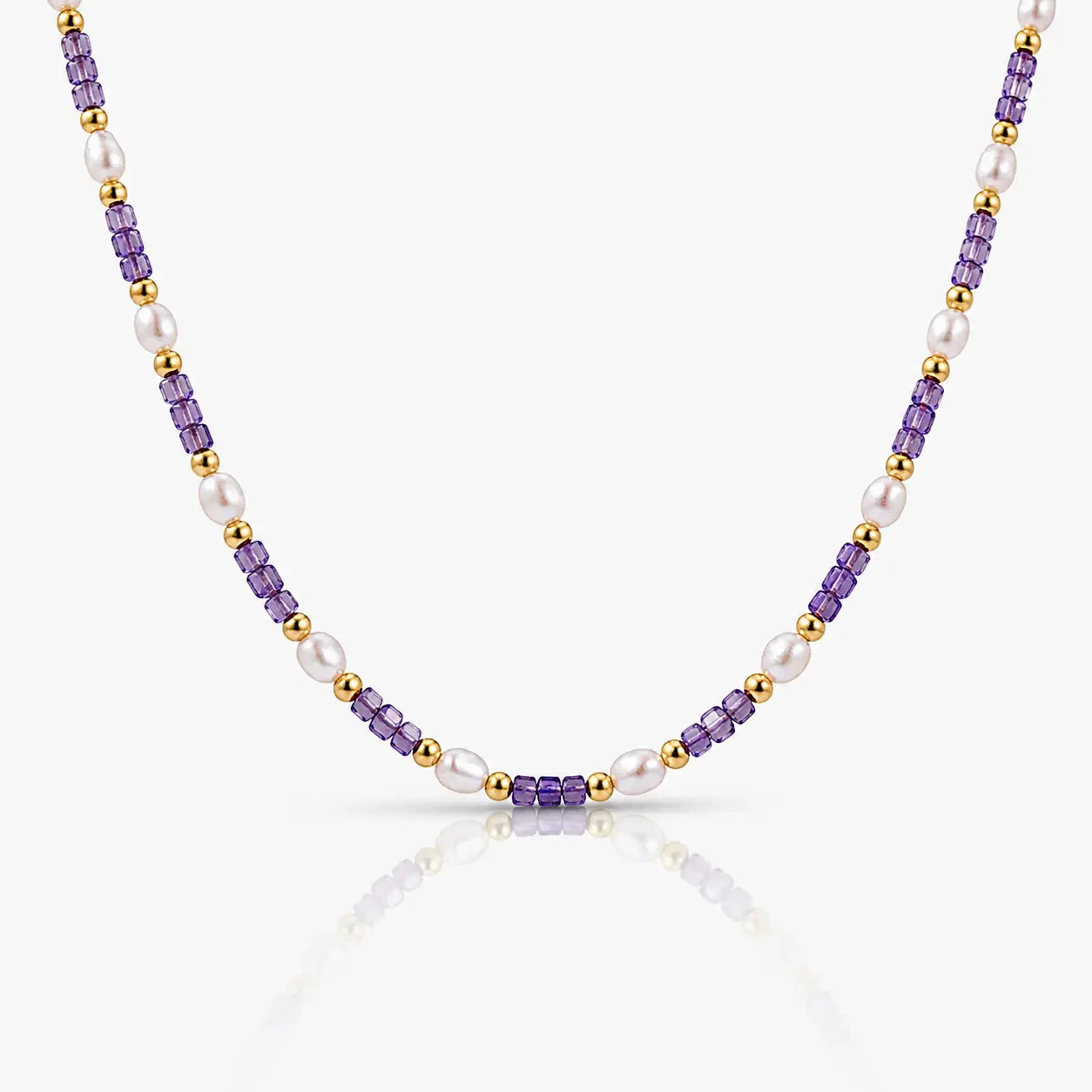 Necklace with purple, gold, and white beads on a white background