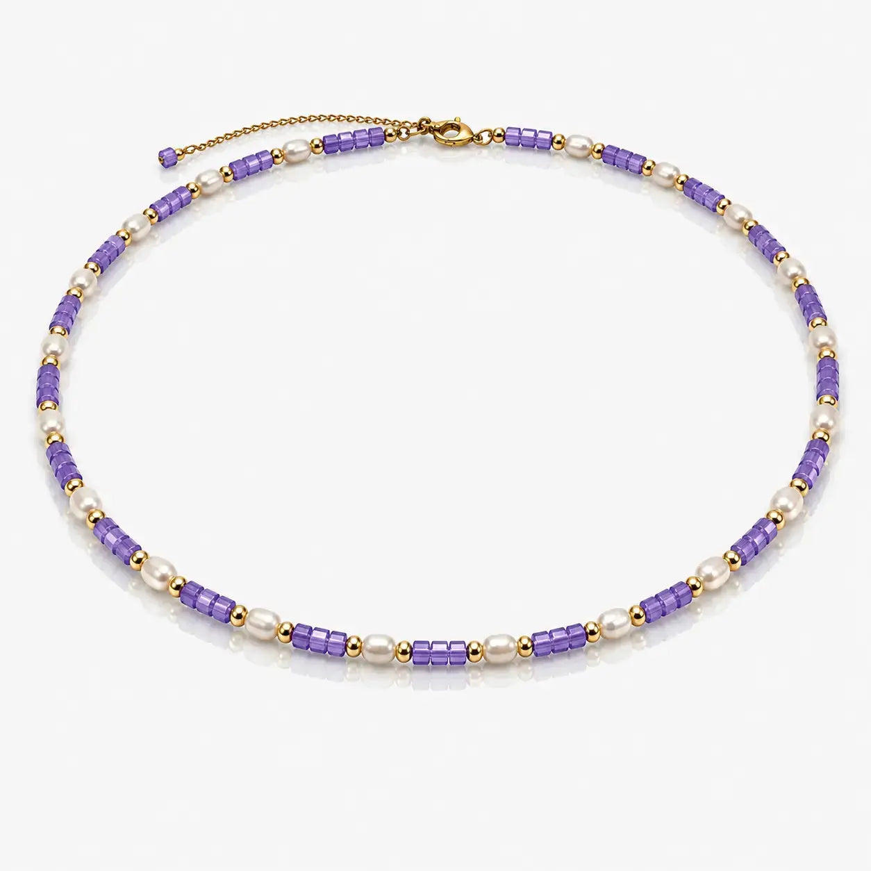 Necklace with purple and gold beads on a white background