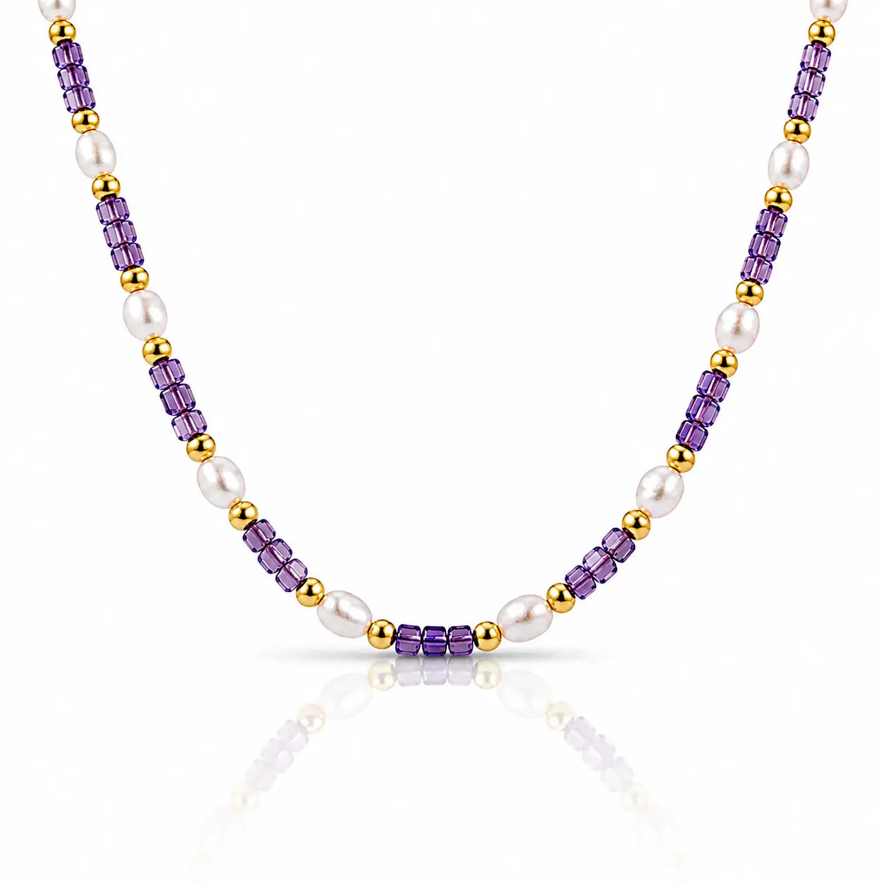 A beaded necklace featuring alternating strands of faceted purple amethyst beads, white freshwater pearls, and polished gold spacer beads, displayed on a clean white background with a soft reflection.