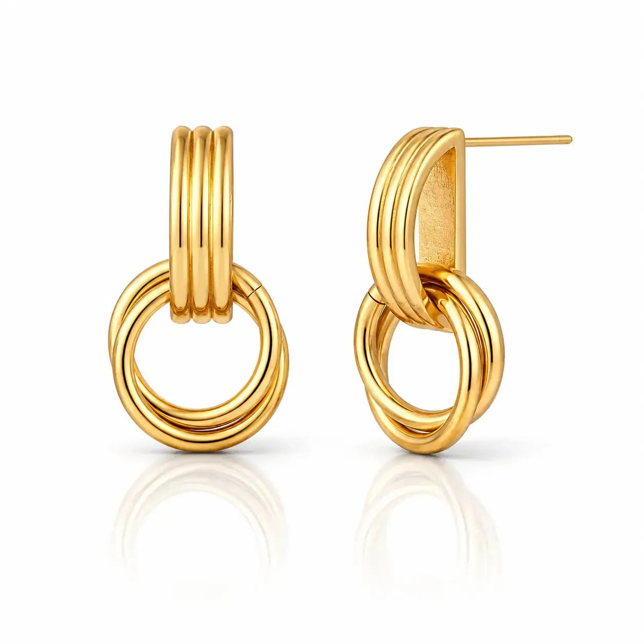 A pair of gold hoop earrings with a triple-ring design, shown on a clean white background with a soft reflection below.