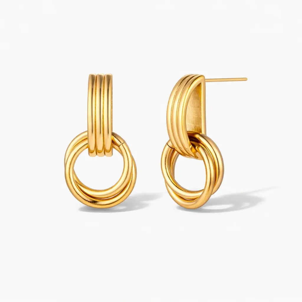 18K gold plated linear loop earrings with interlocking circular design on white background