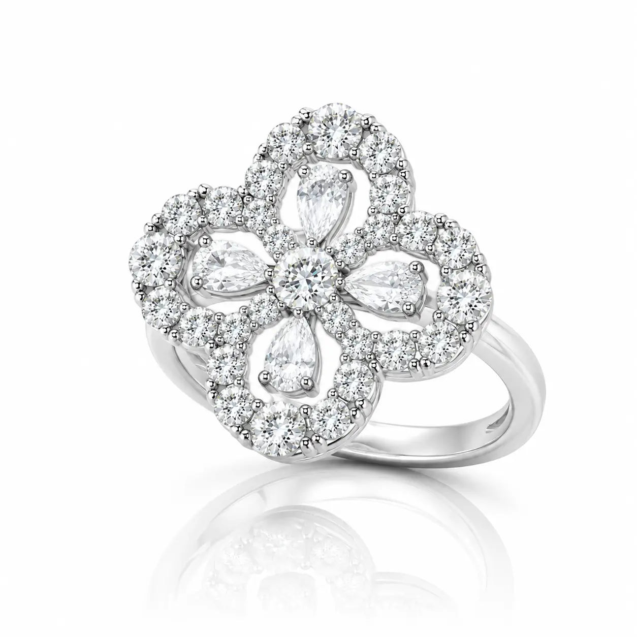 A silver-tone flower ring featuring multiple clear gemstones, including marquise and round cuts, set against a clean white background with a soft reflection below.