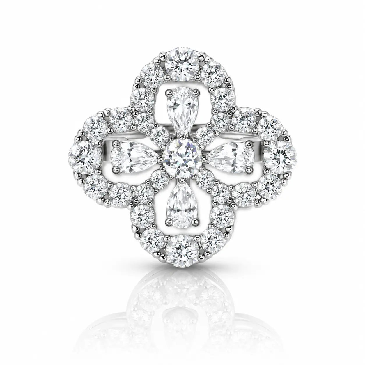 A silver-toned clover-shaped halo ring set with round and marquise-cut clear diamonds, centered on a white background with a soft reflection below.