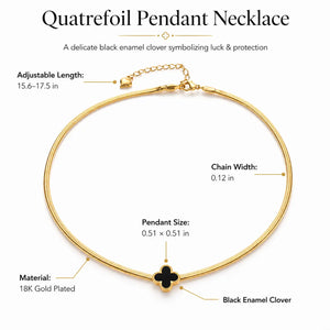 Quatrefoil pendant necklace with gold chain and black enamel clover on a white background