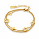 A gold double-layer chain bracelet with star and clover motifs, displayed on a clean white background.