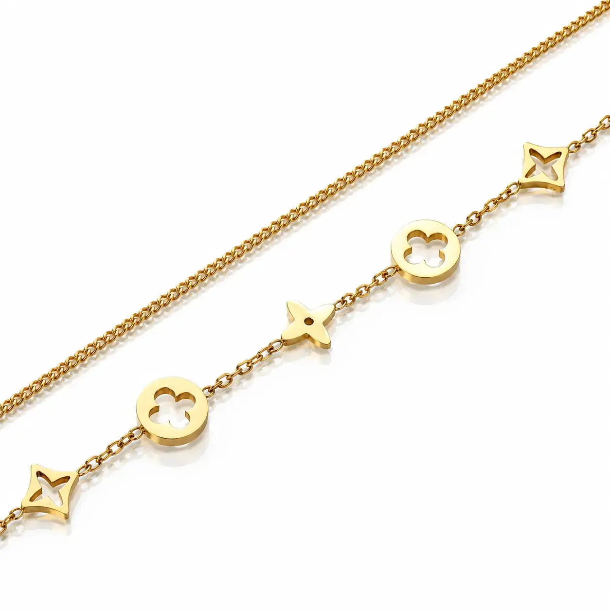 A gold chain bracelet featuring openwork monogram-style charms, including a four-leaf clover, a star, and a trefoil, displayed on a clean white background.