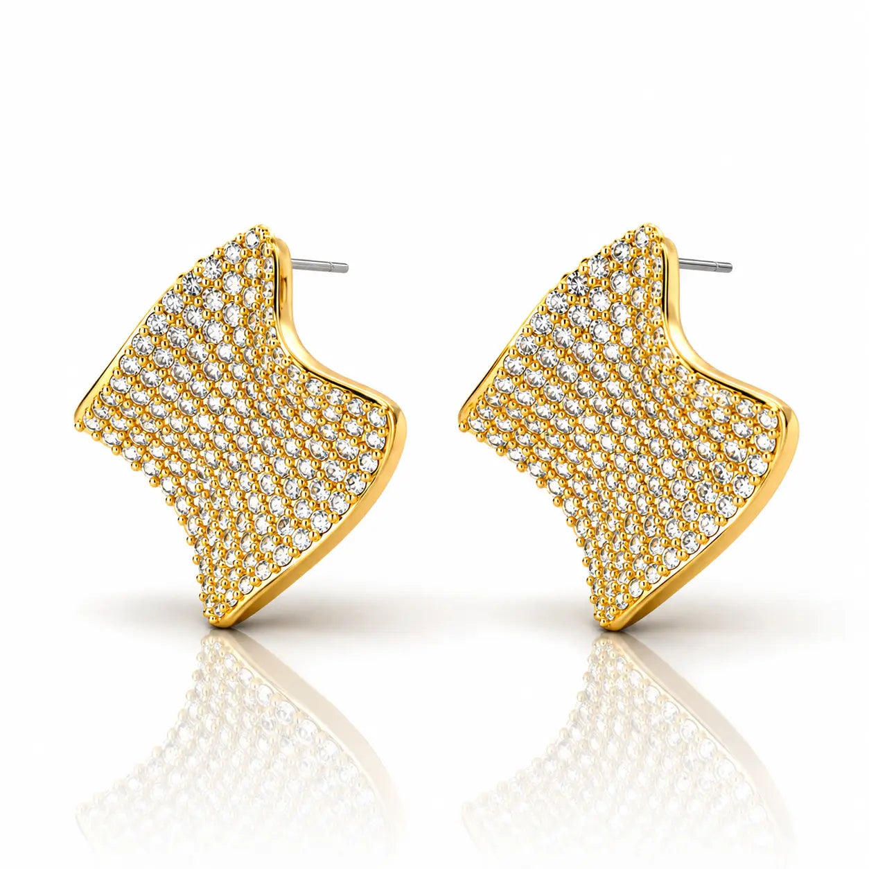 Gold earrings with diamond-like stones on a white background