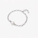 Rhodium-plated silver chain bracelet with single white pearl and adjustable clasp on white background
