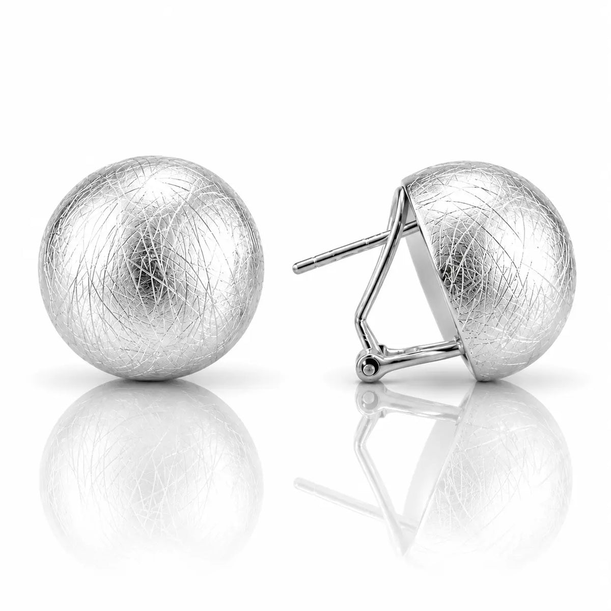 A pair of silver ball stud earrings with a textured, fibrous outer layer and polished inner settings, shown on a reflective white surface.