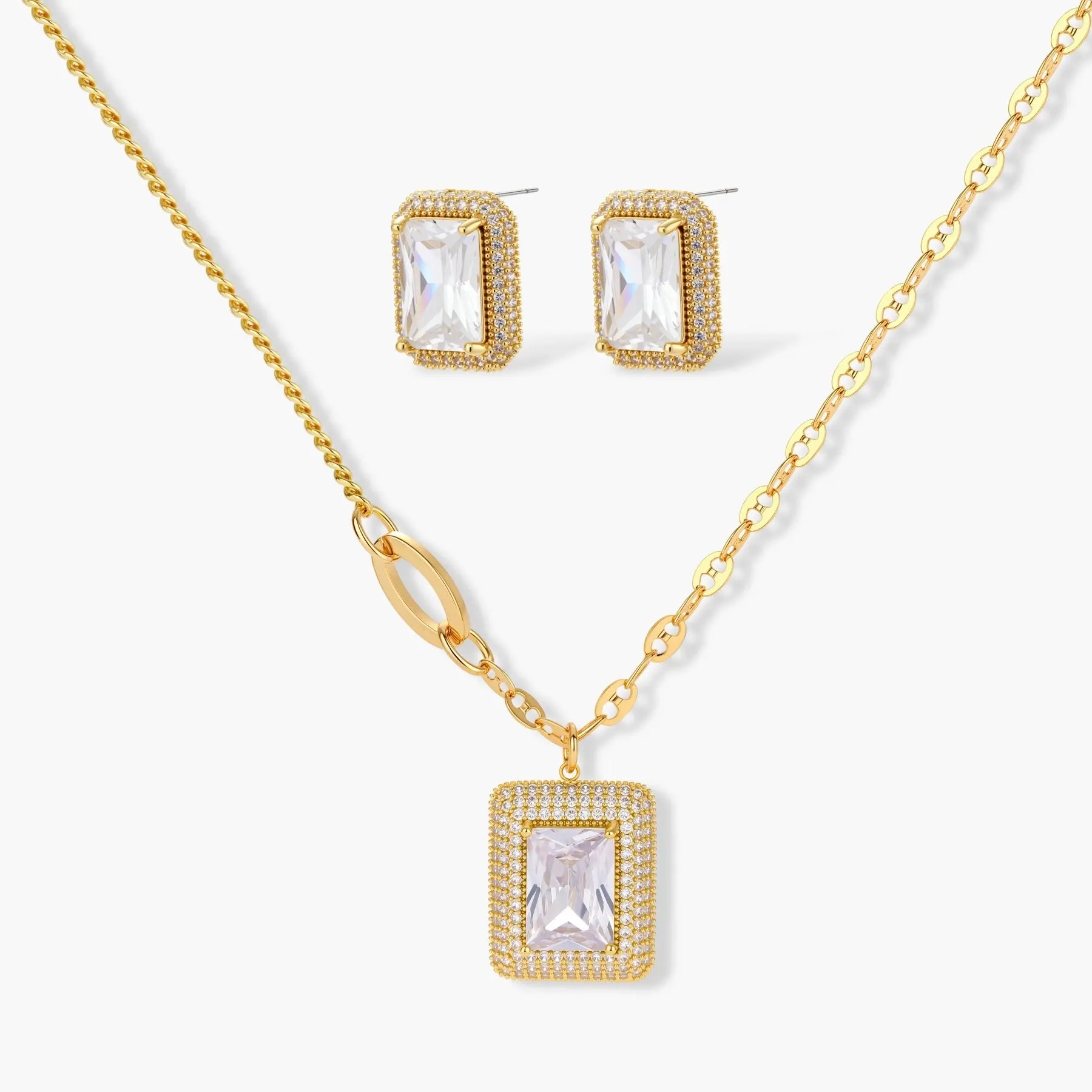 Gold halo necklace and earrings set with rectangular clear gemstones on white background