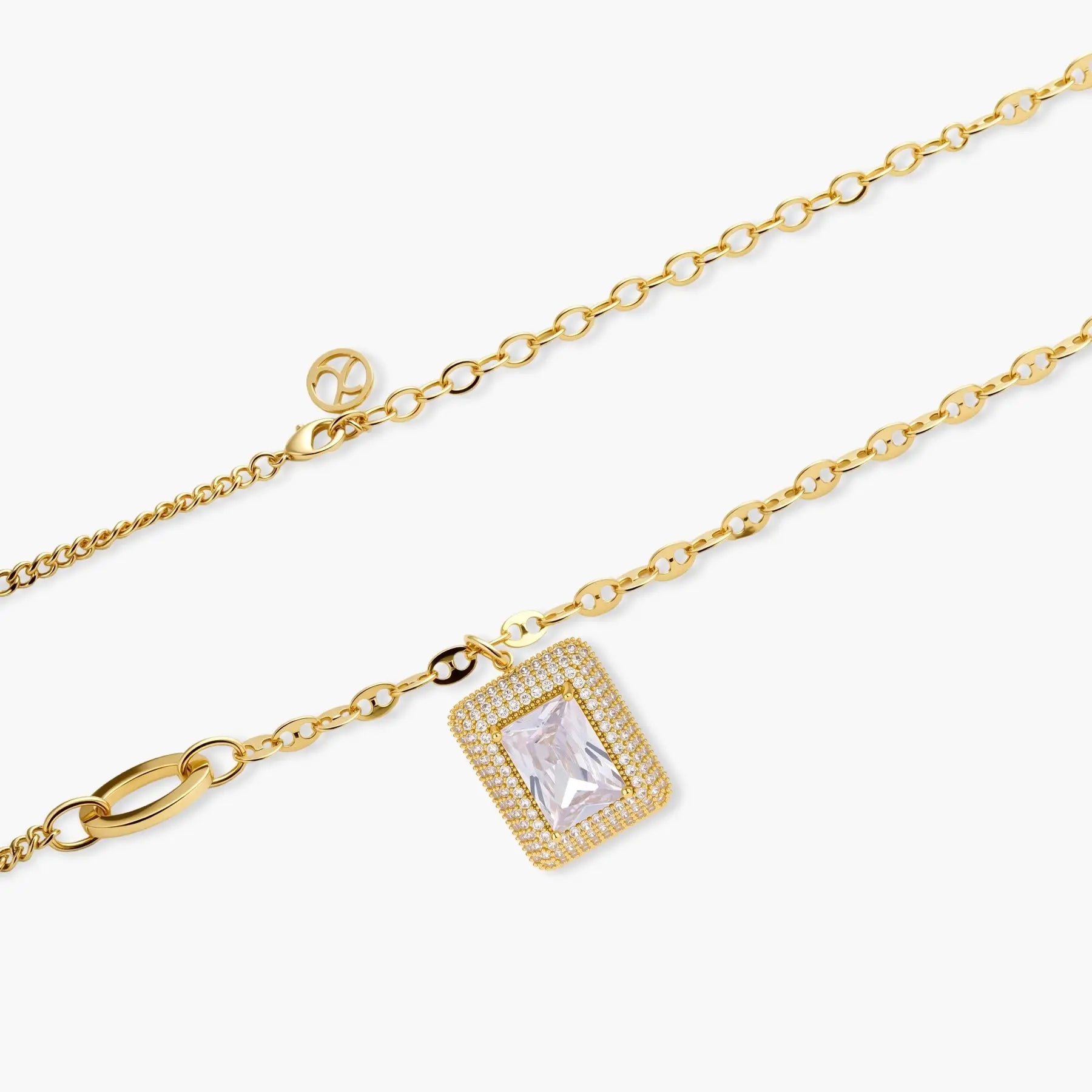 Gold chain necklace with rectangular halo pendant featuring a clear gemstone and pavé accents