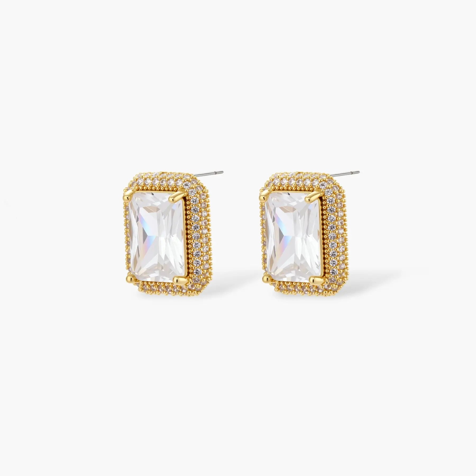 Gold halo stud earrings with rectangular clear gemstones and pavé detailing on white background