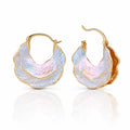 Gold hoop earrings with a textured, multicolored design on a white background