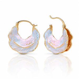 Gold hoop earrings with a textured, multicolored design on a white background