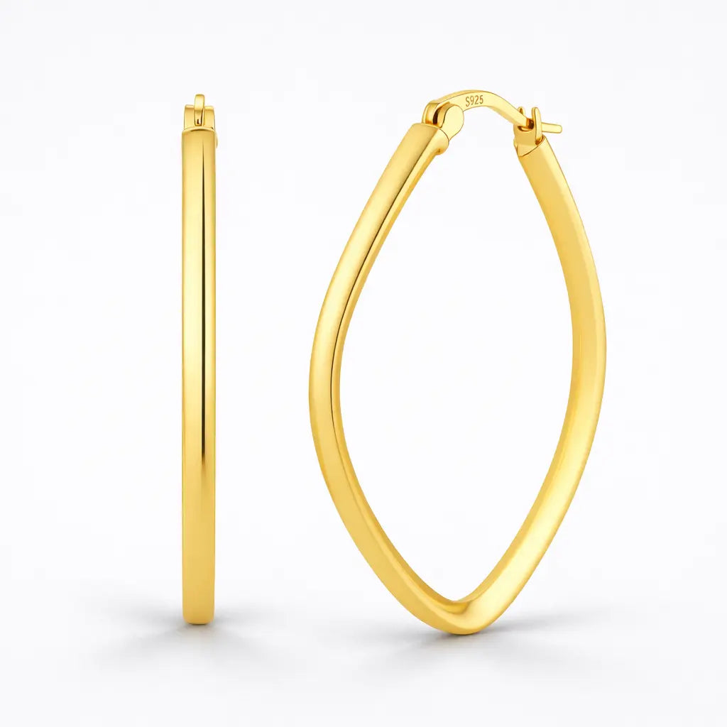 Gold hoop earrings on a white background