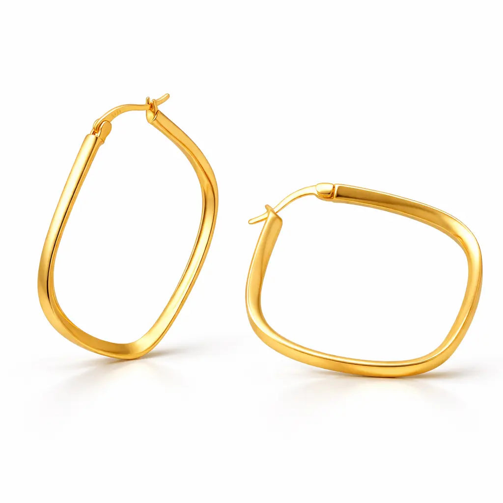 Gold hoop earrings on a white background