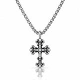 A silver-toned cross pendant necklace with a small clear stone set in the center, hanging from a matching chain against a white background with a soft reflection below.