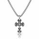 A silver-toned cross pendant necklace with a small clear stone set in the center, hanging from a matching chain against a white background with a soft reflection below.