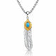 A silver-toned feather pendant necklace with a textured silver feather body, a gold-toned top section, and a round turquoise blue stone in the center, suspended from a silver chain on a white background.