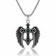 A silver-toned angel wing pendant necklace with a central green gemstone and black accents, suspended from a silver chain on a white background with a reflection below.