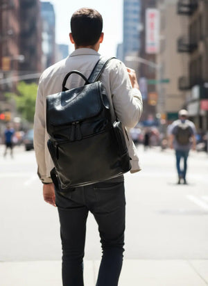 MetroCraft unisex PU leather laptop backpack in Black or Brown, minimalist design, 12×35×40 cm, lightweight 0.8 kg.