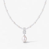 Silver pearl drop necklace with gemstone accents and elegant pearl strand