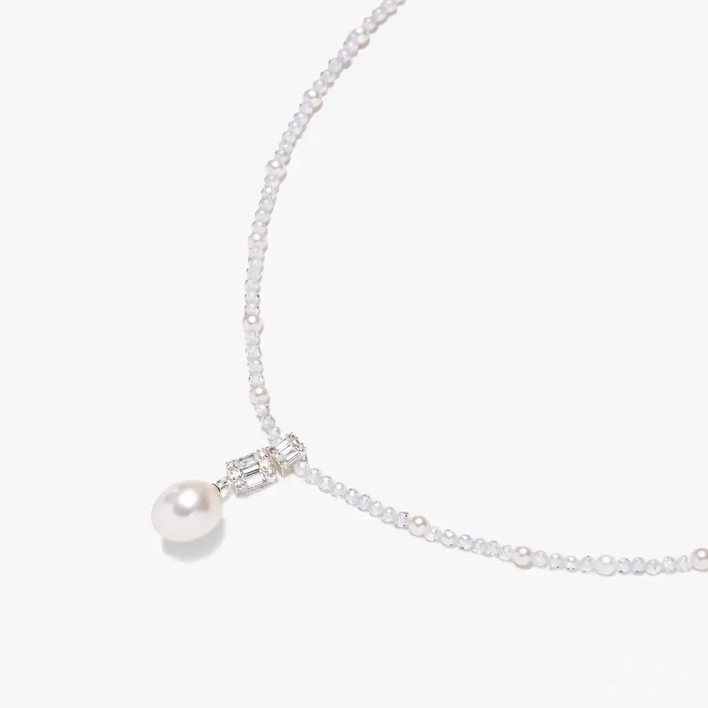 925 silver necklace with pearl drop pendant and beaded chain on white background