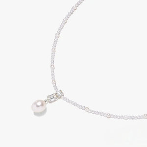 925 silver necklace with pearl drop pendant and beaded chain on white background