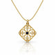 A gold filigree pendant necklace featuring a diamond-shaped openwork design with a central dark blue oval stone and small clear stones, shown on a white background with a soft reflection.