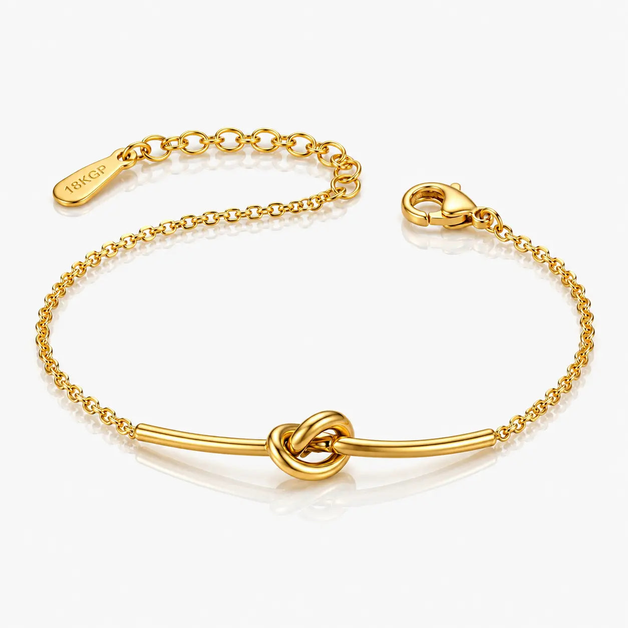 Gold bracelet with knot design on a white background