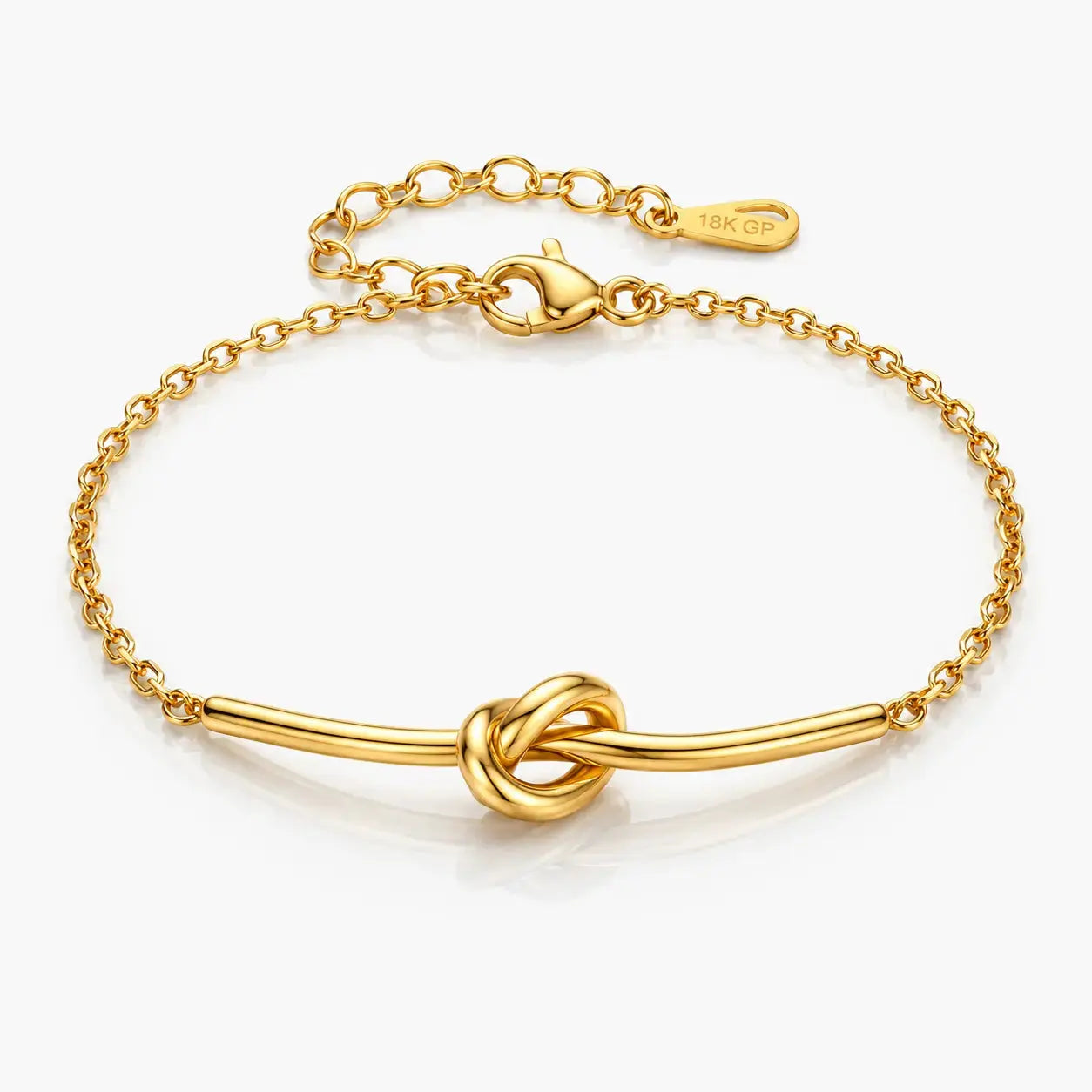 Gold bracelet with a knot design on a white background
