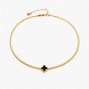 18K gold necklace with black clover pendant on white background, minimalist jewelry