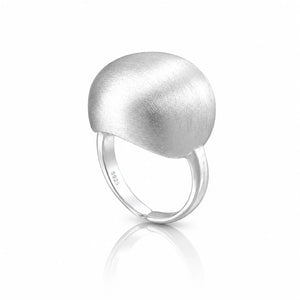 A modern silver ring featuring a large, rounded, dome-like top with a brushed matte texture and a polished band, shown on a clean white background with a soft reflection.