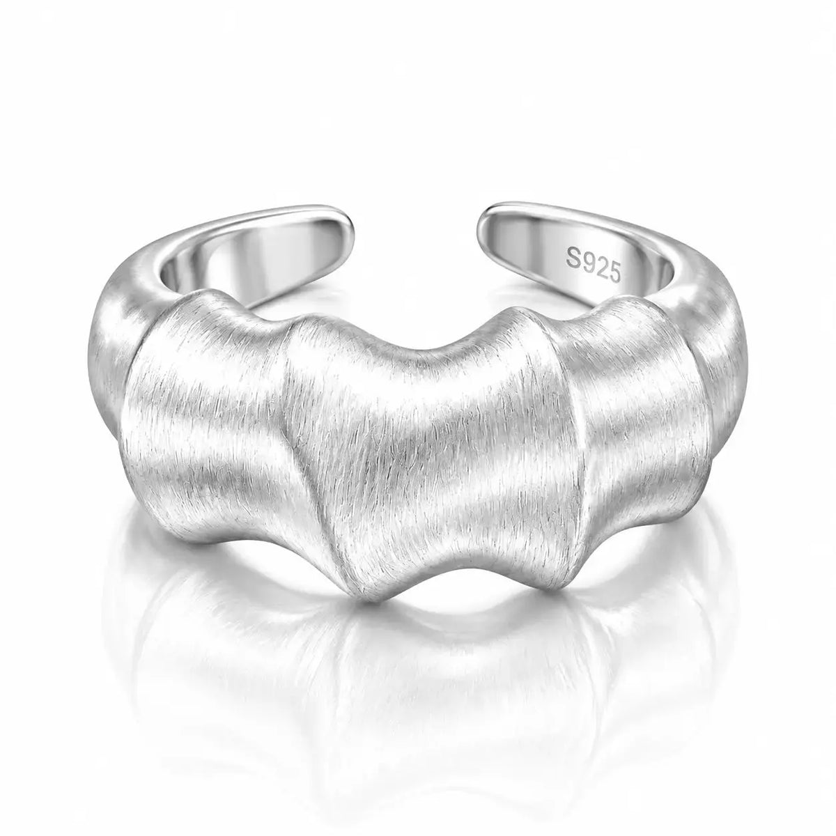 A silver adjustable ring with a wavy, textured design and a brushed finish, featuring an 'S925' sterling silver hallmark on the inner band, set against a clean white background with a soft reflection.