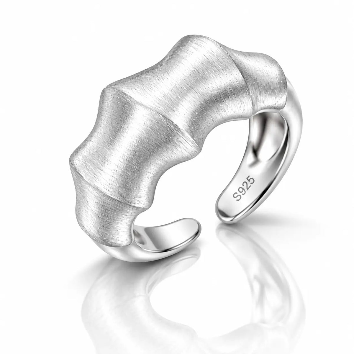 A silver open ring with a sculptural, wavy bamboo-like textured band, featuring a brushed finish on the top and polished edges. The inner band is engraved with 'S925'.