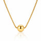 A gold box chain necklace with a polished spherical bead pendant, displayed against a clean white background with a soft reflection below.