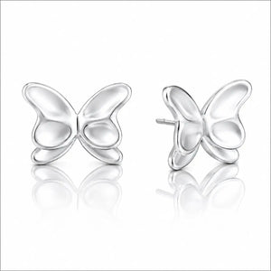 A pair of silver butterfly stud earrings shown on a clean white background with soft reflections below. One earring is facing forward and the other is angled to show the side profile and post.