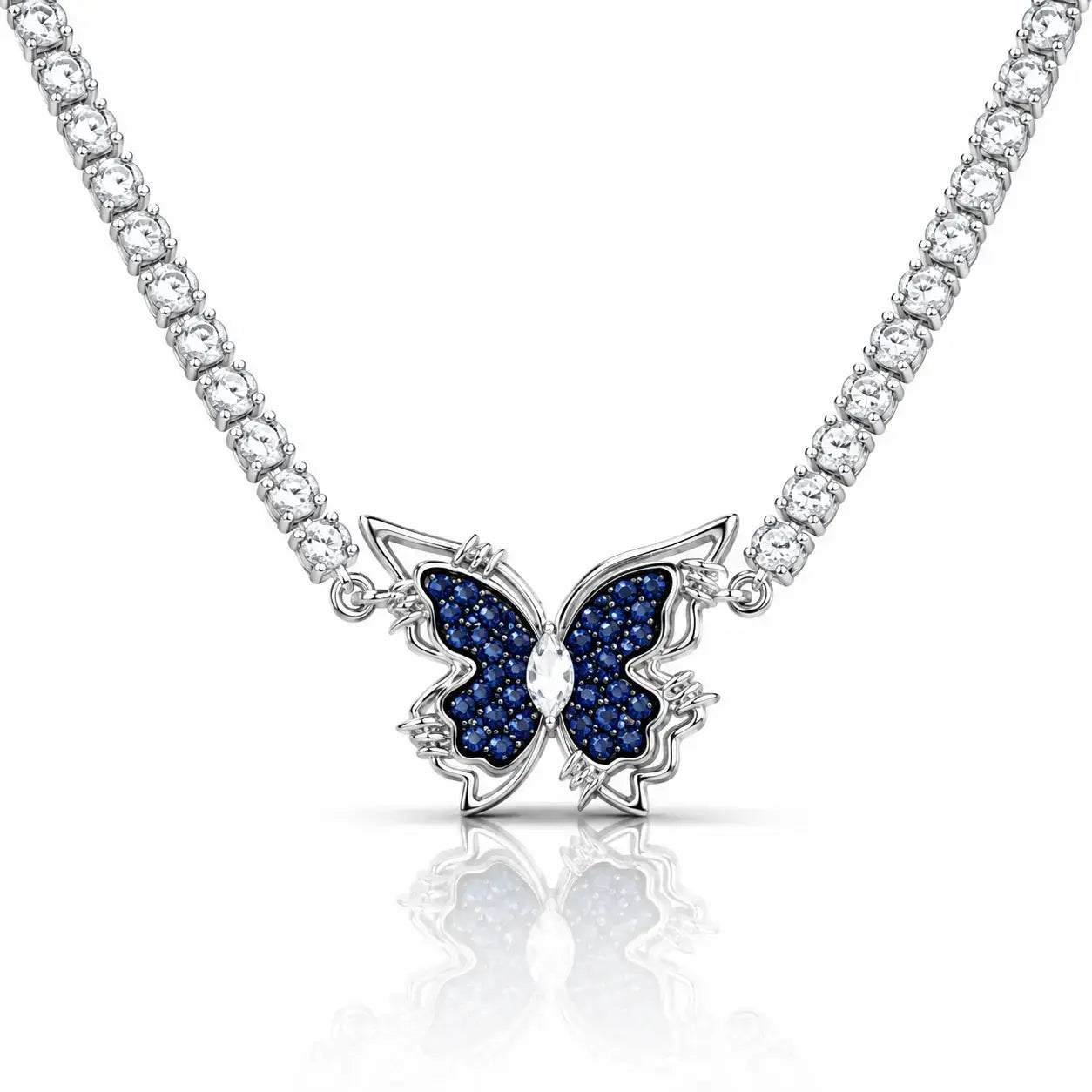 A silver-tone butterfly pendant necklace featuring dark blue pavé-set wings and a clear central stone, suspended from a sparkling silver chain on a white background with a soft reflection.