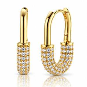 A pair of gold hoop earrings with pavé-set clear stones, shown on a clean white background with a soft reflection below.
