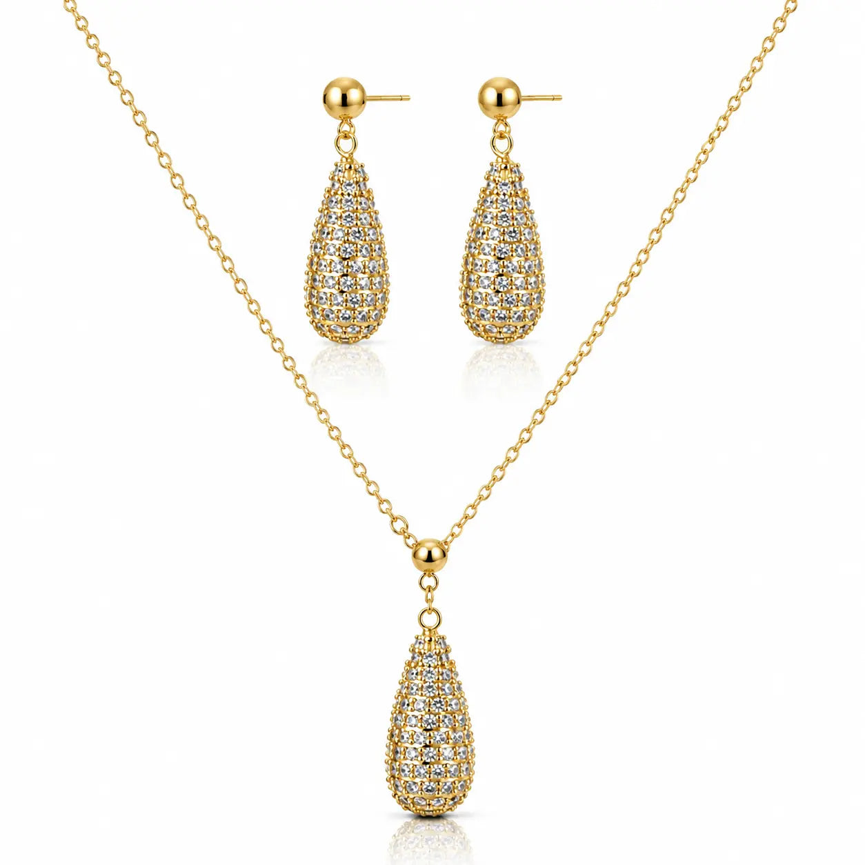 Gold jewelry set featuring a teardrop-shaped pendant necklace and matching drop earrings, both adorned with pavé-set clear stones on a white background.