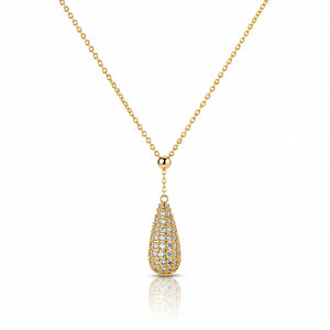 A gold chain necklace with a teardrop-shaped pendant paved with small clear stones, shown on a clean white background with a soft reflection below.