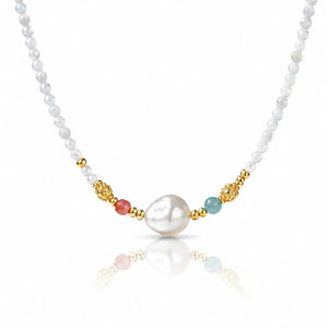 A delicate white pearl beaded necklace featuring a central irregular white pearl, accented by gold-toned beads, a small coral-red bead, and a light blue-green bead on a white background.