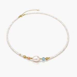 Freshwater pearl and gemstone beaded necklace with gold vermeil accents on white background.