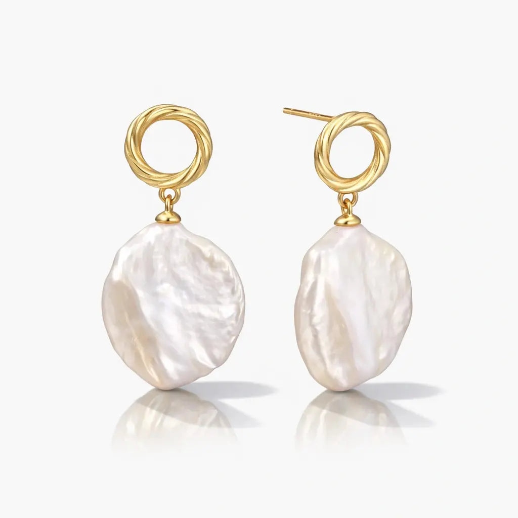 Baroque pearl drop earrings with twisted 18K gold vermeil hoops on white background