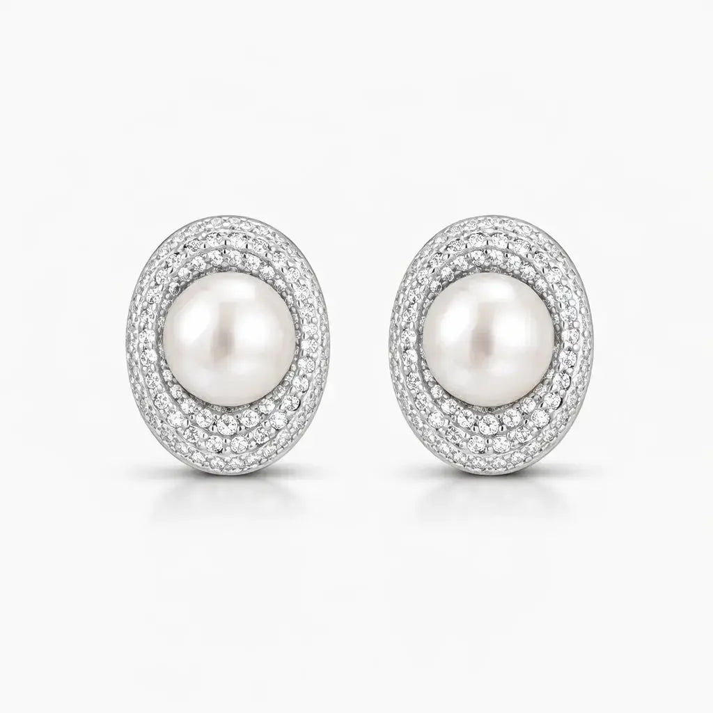 Elegant pearl stud earrings with sparkling crystal halo on white background